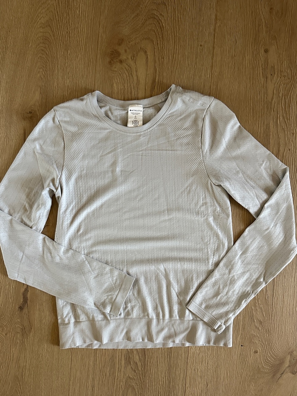 Athleta Seamless Long Sleeve Active Top in light gray.